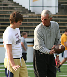 Ray Guy instructing camp participant NFL Punting Legend Ray Guy